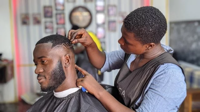 Meet Adwoa Pee, a beautiful female barber in Ghana trending on social media